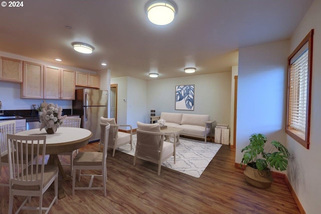 720 G Ave Unit D, Seaside, OR 97138 - dining room featuring wood finished floors, radiator heating unit, baseboards, and recessed lighting