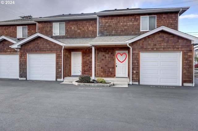 front of property with a garage