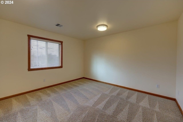 spare room featuring carpet flooring