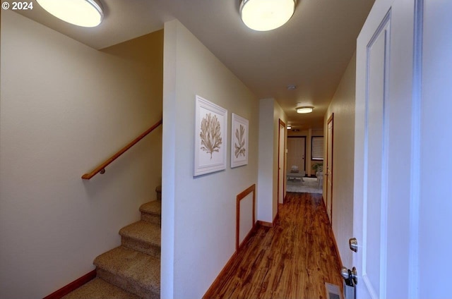720 G Ave Unit D, Seaside, OR 97138 - hallway featuring dark wood-type flooring, stairway, and baseboards