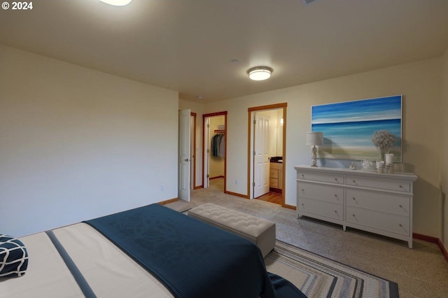 720 G Ave Unit D, Seaside, OR 97138 - bedroom with baseboards, carpet, a spacious closet, connected bathroom, and a closet