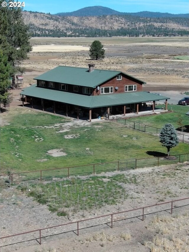 view of yard featuring a mountain view and a rural view