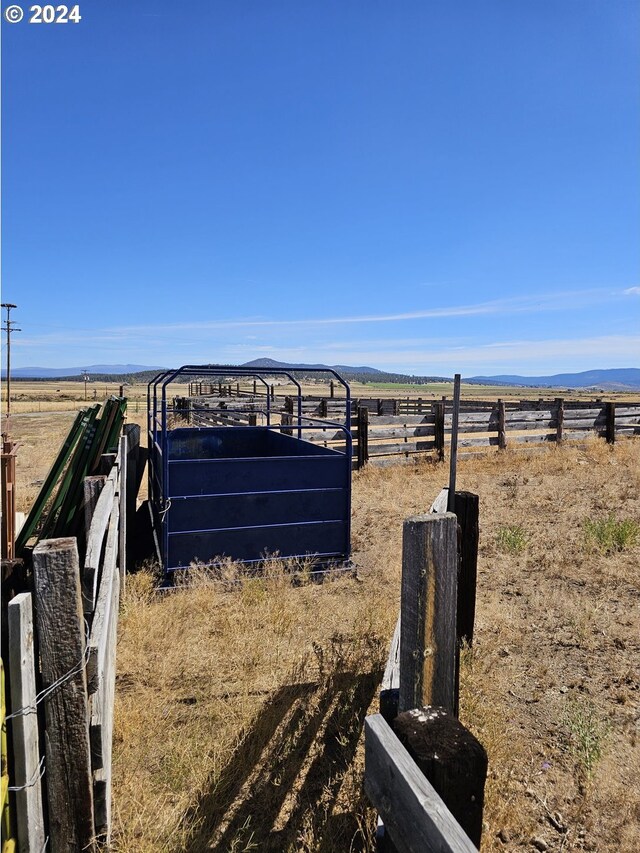 view of yard with a rural view