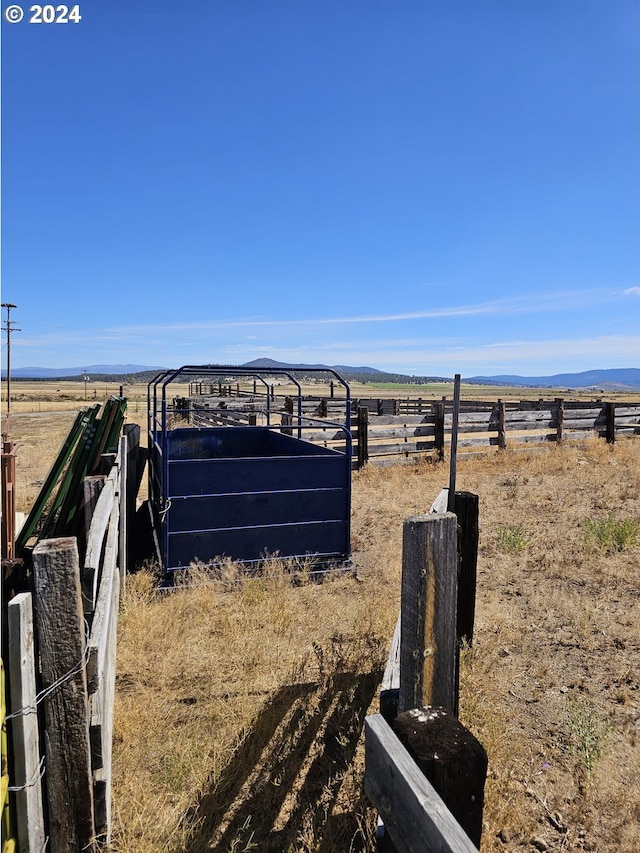 view of yard with a rural view