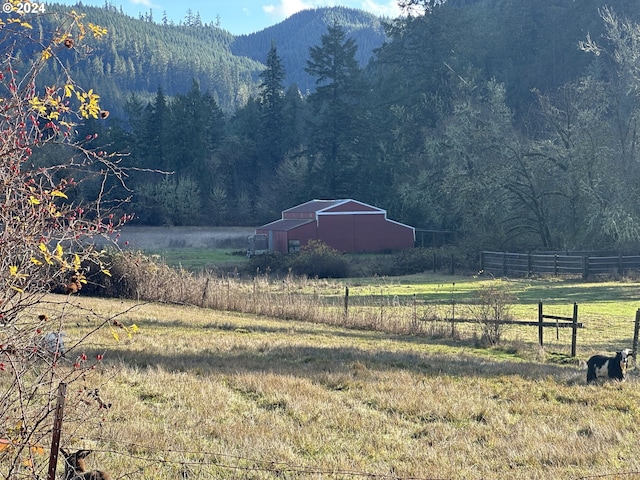 view of mountain feature with a rural view