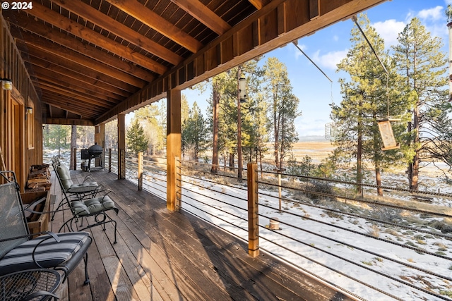 snow covered deck featuring grilling area