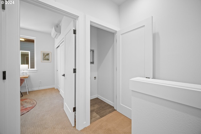 bathroom featuring a wall unit AC