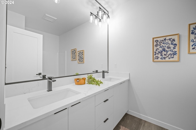 bathroom featuring vanity and hardwood / wood-style flooring