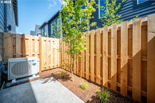 view of yard with ac unit and a patio