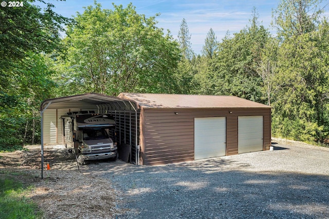 garage featuring a carport