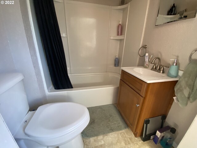 full bathroom with vanity, toilet, and shower / bath combo