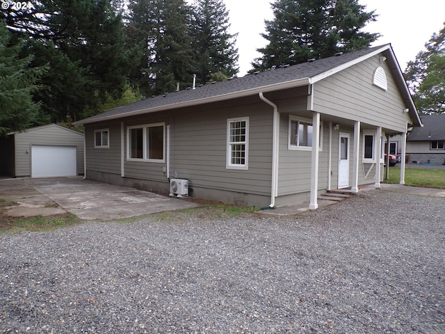 ranch-style home featuring an outbuilding and a garage