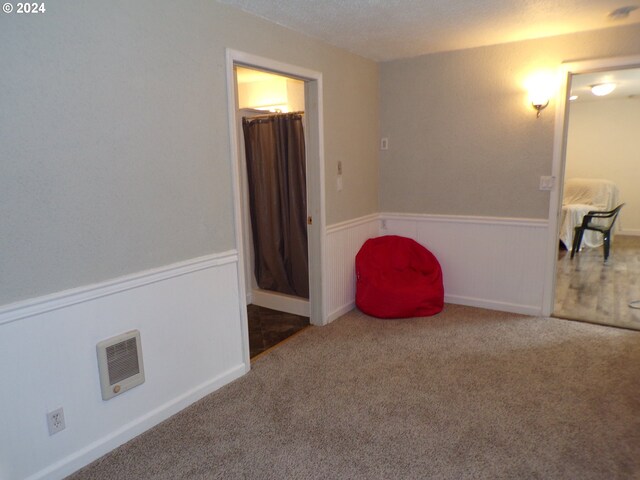 carpeted bedroom with a textured ceiling