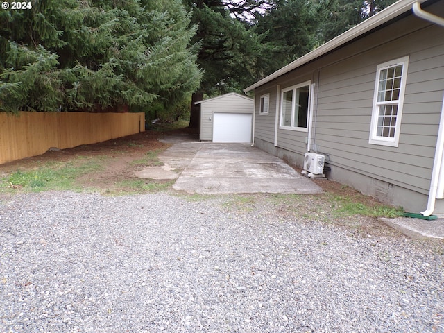 view of yard featuring a garage and an outdoor structure