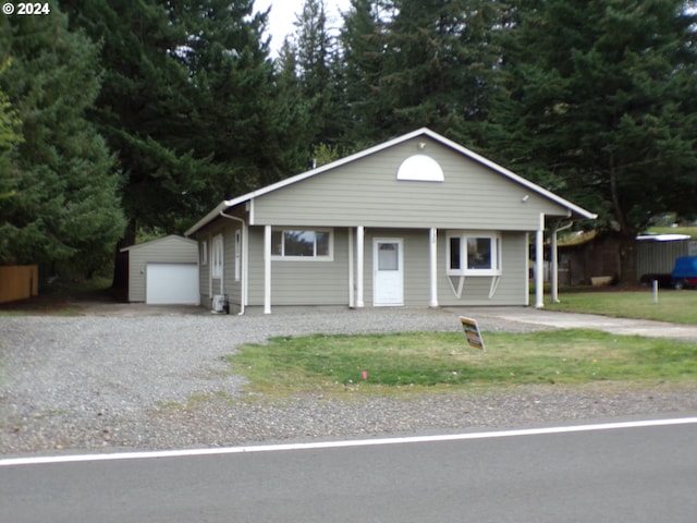 view of front of property with an outbuilding and a garage