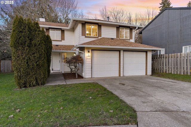 view of front facade featuring a yard and a garage