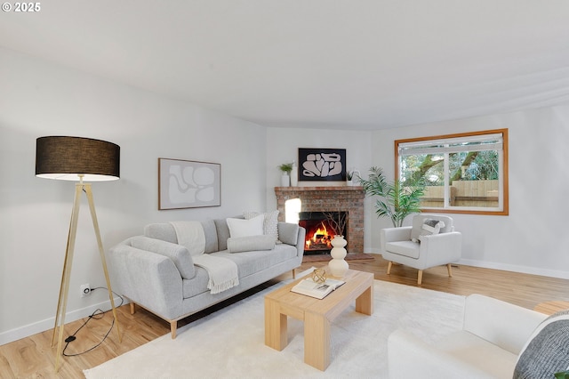 living room with a fireplace and hardwood / wood-style flooring