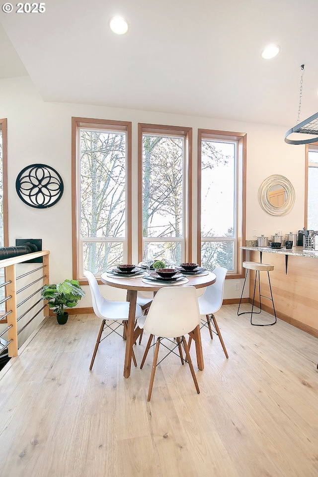 dining area featuring light wood-type flooring