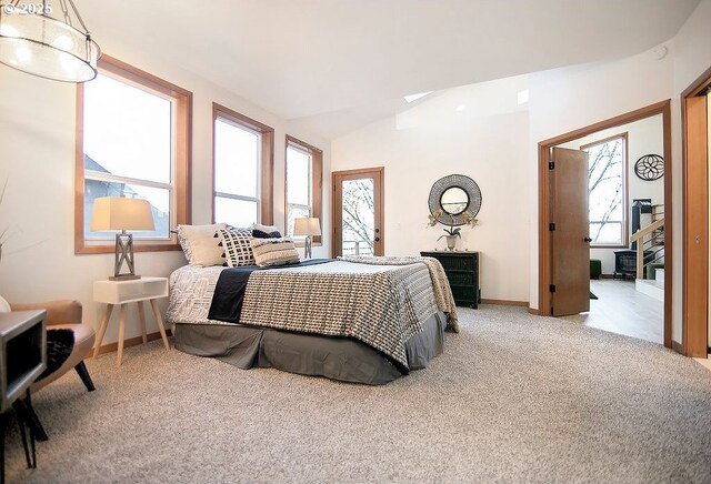 bedroom featuring vaulted ceiling and carpet