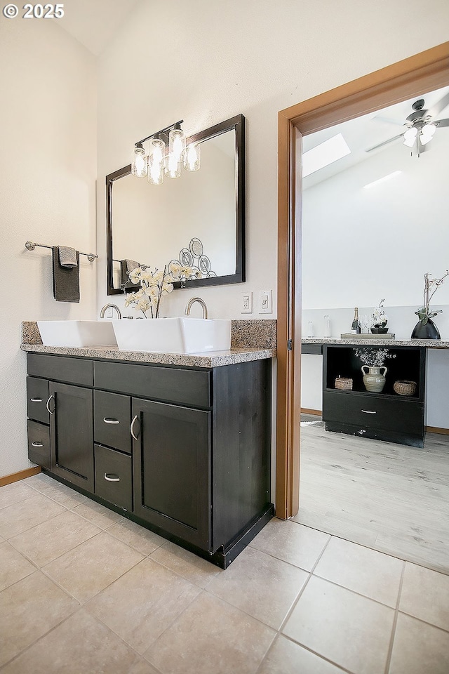 bathroom featuring ceiling fan, tile patterned flooring, and vanity