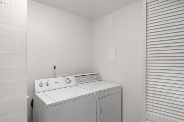 washroom with independent washer and dryer