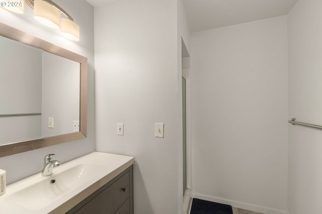 bathroom featuring an enclosed shower and vanity