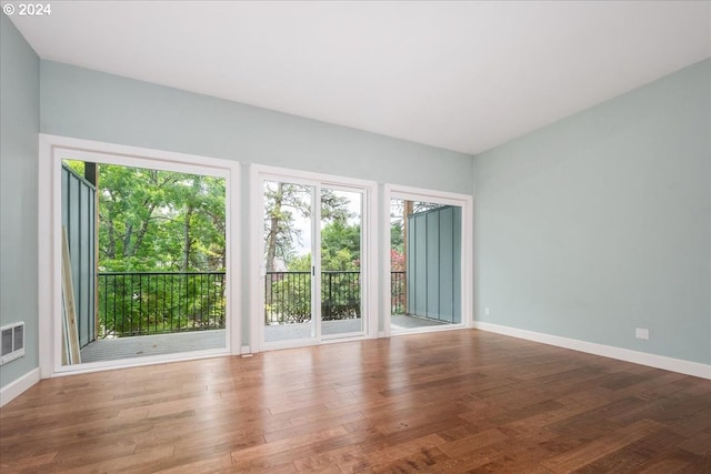 unfurnished room featuring hardwood / wood-style floors