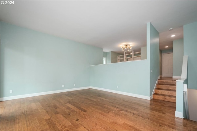 spare room with hardwood / wood-style flooring