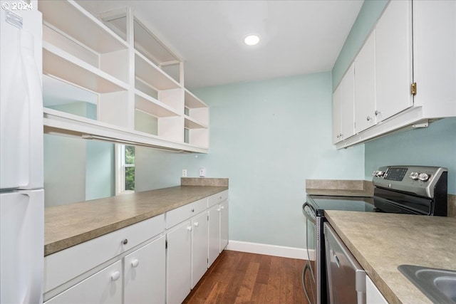 kitchen with white cabinetry, white refrigerator, dark hardwood / wood-style floors, and electric stove