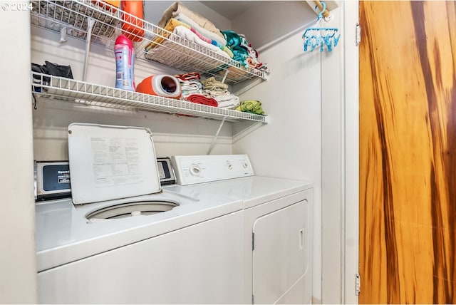 laundry area featuring washing machine and clothes dryer