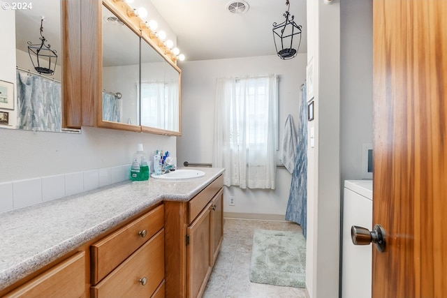 bathroom featuring a shower with shower curtain, tile patterned flooring, and vanity