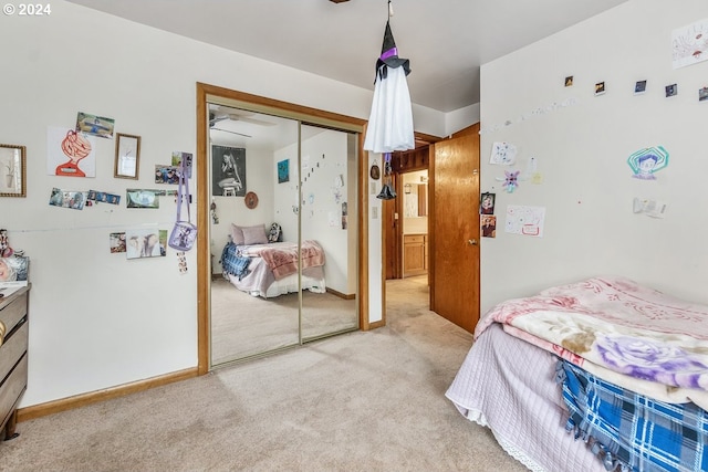 carpeted bedroom with a closet