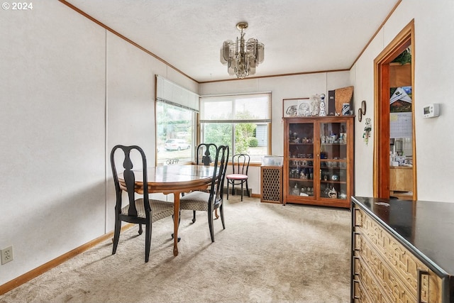 dining room featuring a textured ceiling, carpet, crown molding, and a notable chandelier