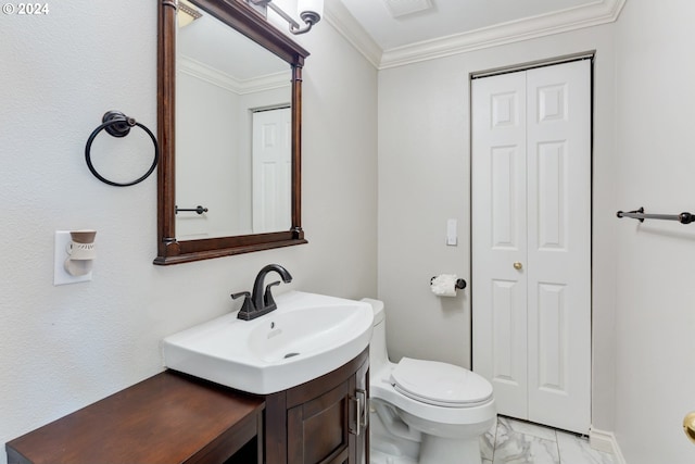 bathroom featuring vanity, toilet, and ornamental molding