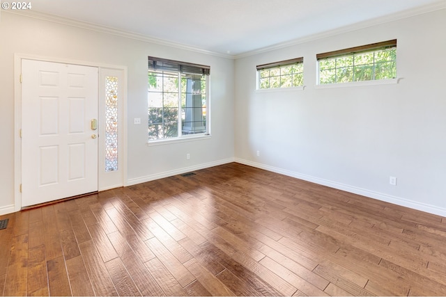 foyer with hardwood / wood-style floors and ornamental molding