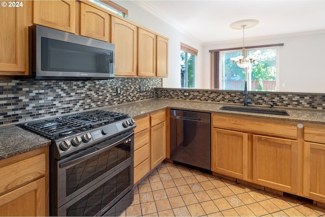 kitchen featuring decorative backsplash, stainless steel appliances, and an inviting chandelier