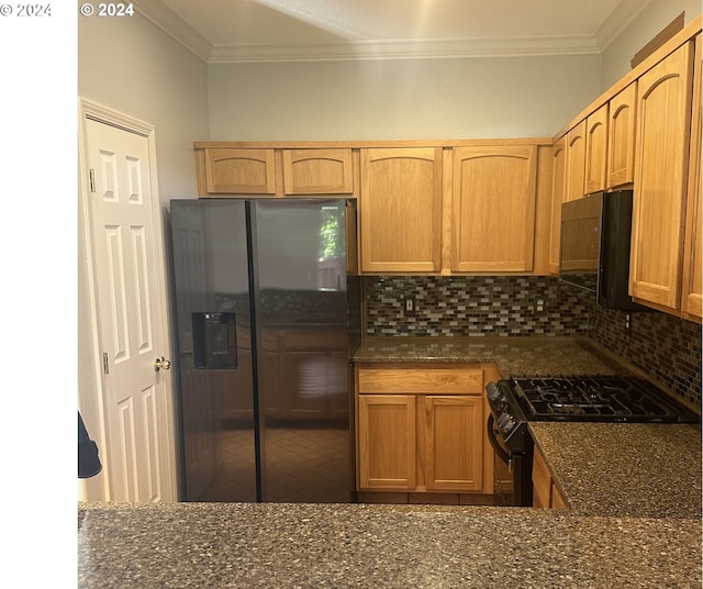 kitchen with decorative backsplash, crown molding, and black appliances