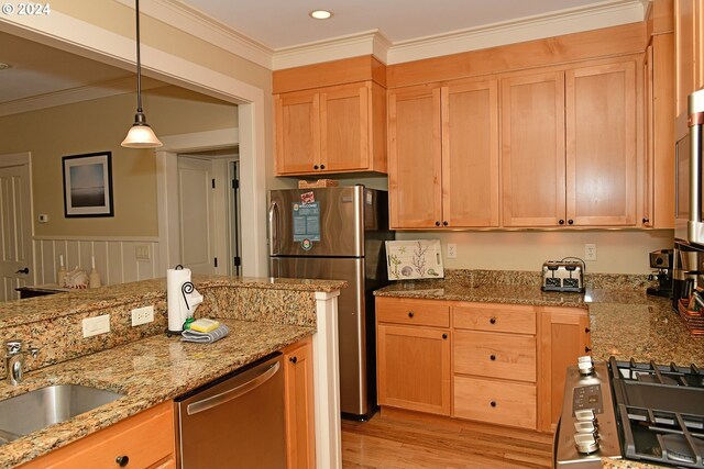 kitchen with light wood-type flooring, stainless steel appliances, ornamental molding, and light stone countertops