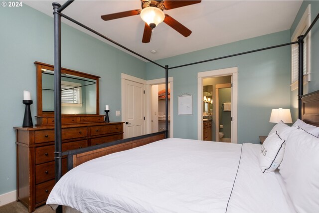 bedroom with carpet, ceiling fan, and ensuite bathroom