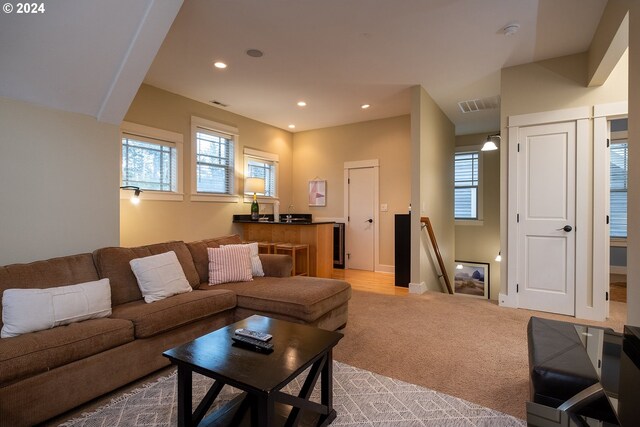 living room with light colored carpet