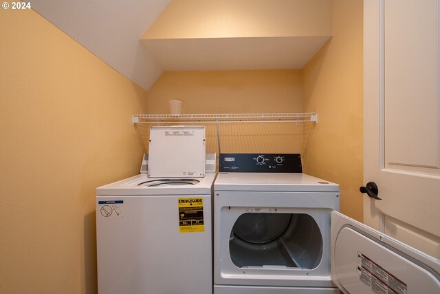 laundry room with washing machine and clothes dryer