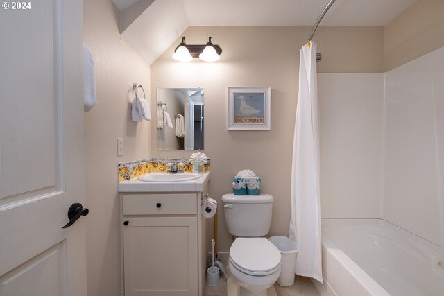 full bathroom with vanity, shower / bath combo, and toilet