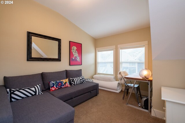 living room featuring carpet flooring and lofted ceiling