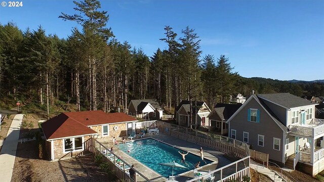 view of swimming pool with an outdoor structure