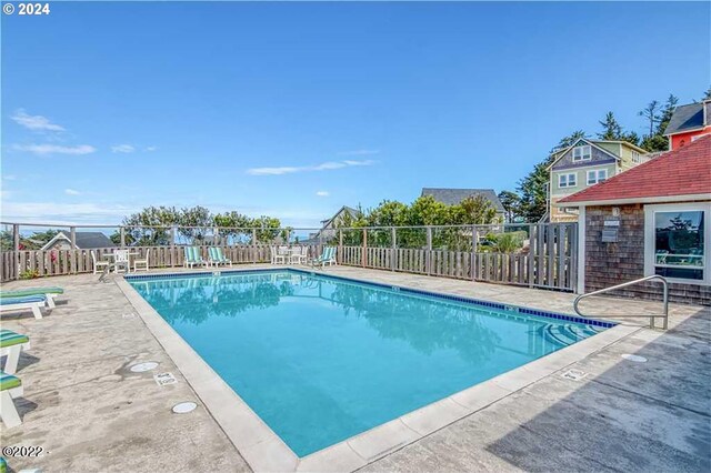 view of swimming pool with a patio area