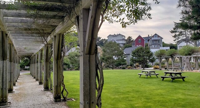 view of property's community with a lawn