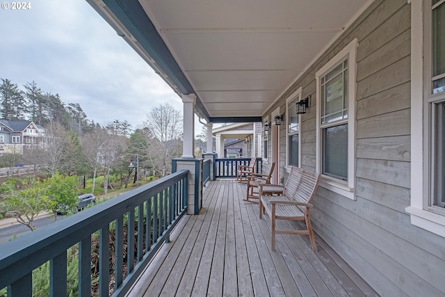 wooden terrace with a porch