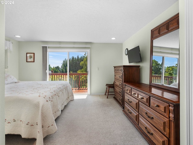 bedroom featuring light carpet, access to outside, and multiple windows