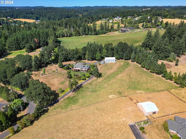 birds eye view of property featuring a rural view