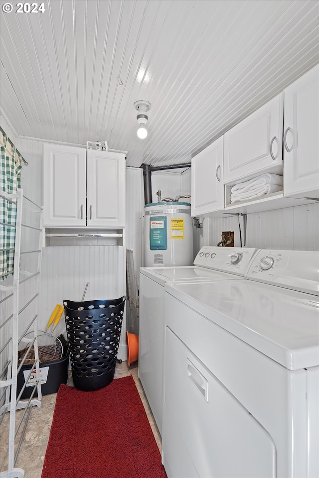 laundry room featuring wood ceiling, cabinets, independent washer and dryer, and water heater